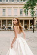 Woman wearing Monique Lhuillier Spring 2024 Bliss white strapless mikado BL24101 ballgown
