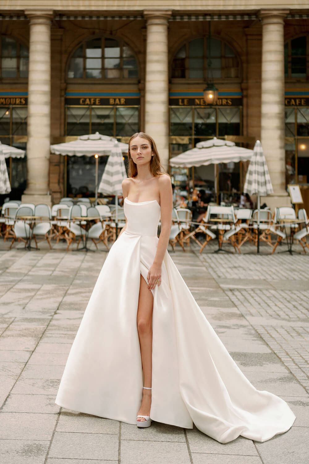 Woman wearing Monique Lhuillier Spring 2024 Bliss white strapless mikado BL24101 ballgown