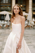 Woman wearing Monique Lhuillier Spring 2024 Bliss white strapless mikado BL24101 ballgown