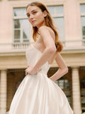 Woman wearing Monique Lhuillier Spring 2024 Bliss white strapless mikado BL24101 ballgown
