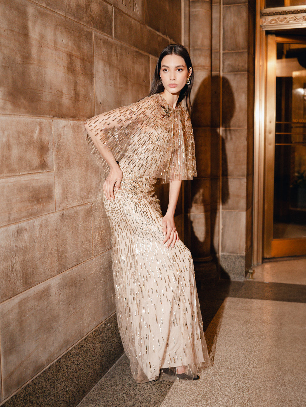 Monique Lhuillier Fall 2025 gold sequin embroidered tulle gown with integral capelet - lookbook.