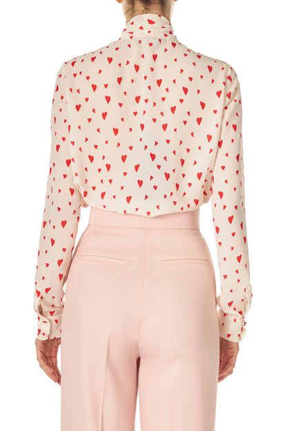 Monique Lhuillier Fall 2024 long sleeve, bow tie blouse in Heart Printed Georgette - back.