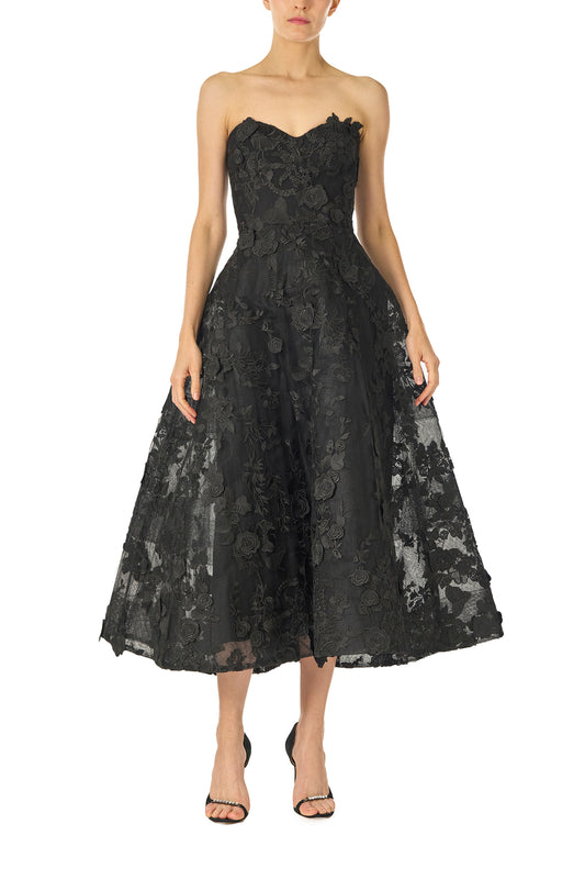 Monique Lhuillier Fall 2024 tea-length, strapless dress in noir 3D lace with full skirt and fitted sweetheart bodice - front.