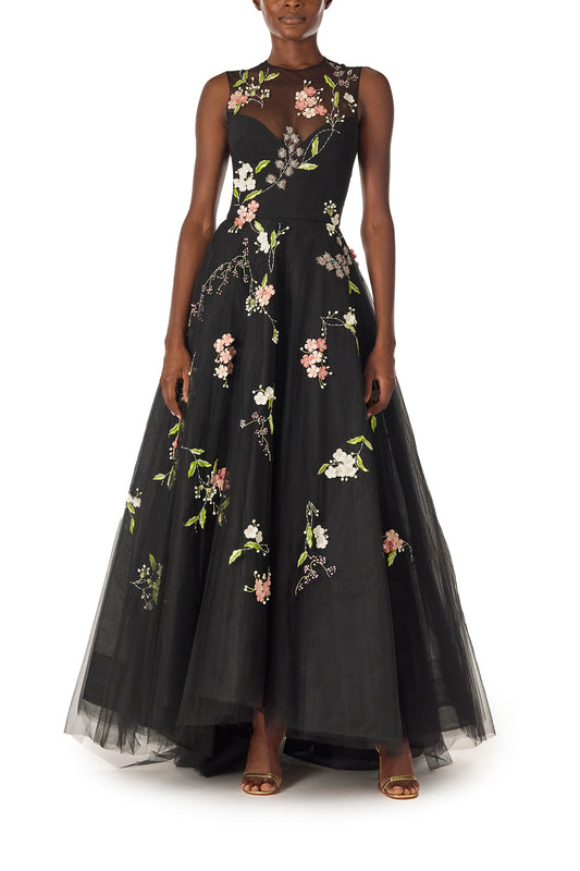 Monique Lhuillier Spring 2025 Sleeveless, noir tulle gown with floral embroidery and slight high-low hem - front.
