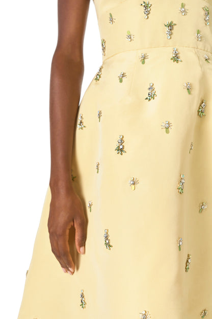 Monique Lhuillier Spring 2025 Embroidered cocktail dress with v-neckline and tea-length skirt  in Limoncello faille - embroidery detail.