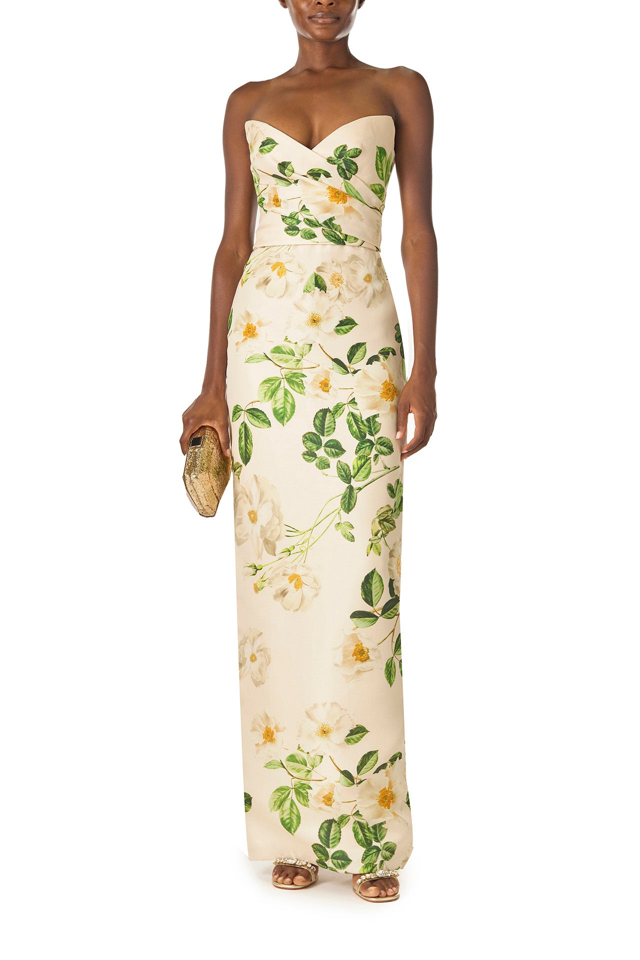 Monique Lhuillier Spring 2025 Strapless, rose printed gazar column gown with sweetheart neckline and draped bodice - front with gold handbag.