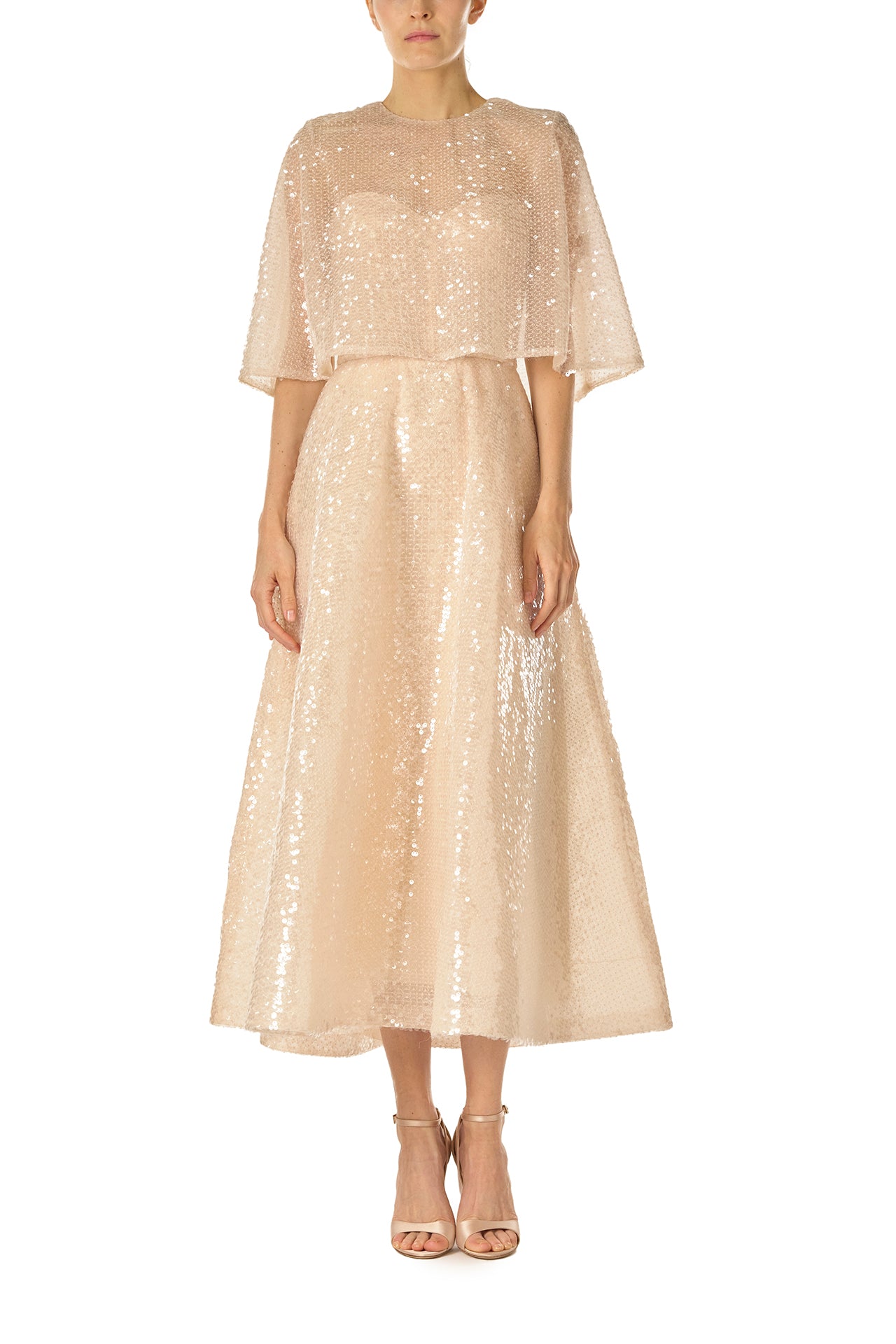 Monique Lhuillier Spring 2025 strapless, tea-length dress with sweetheart neckline in prosecco colored sequins - front with capelet.