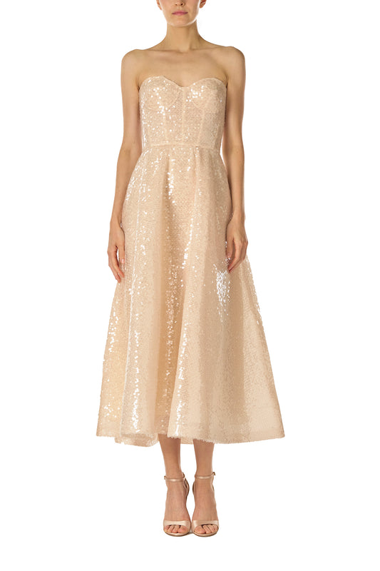 Monique Lhuillier Spring 2025 strapless, tea-length dress with sweetheart neckline in prosecco colored sequins - front.