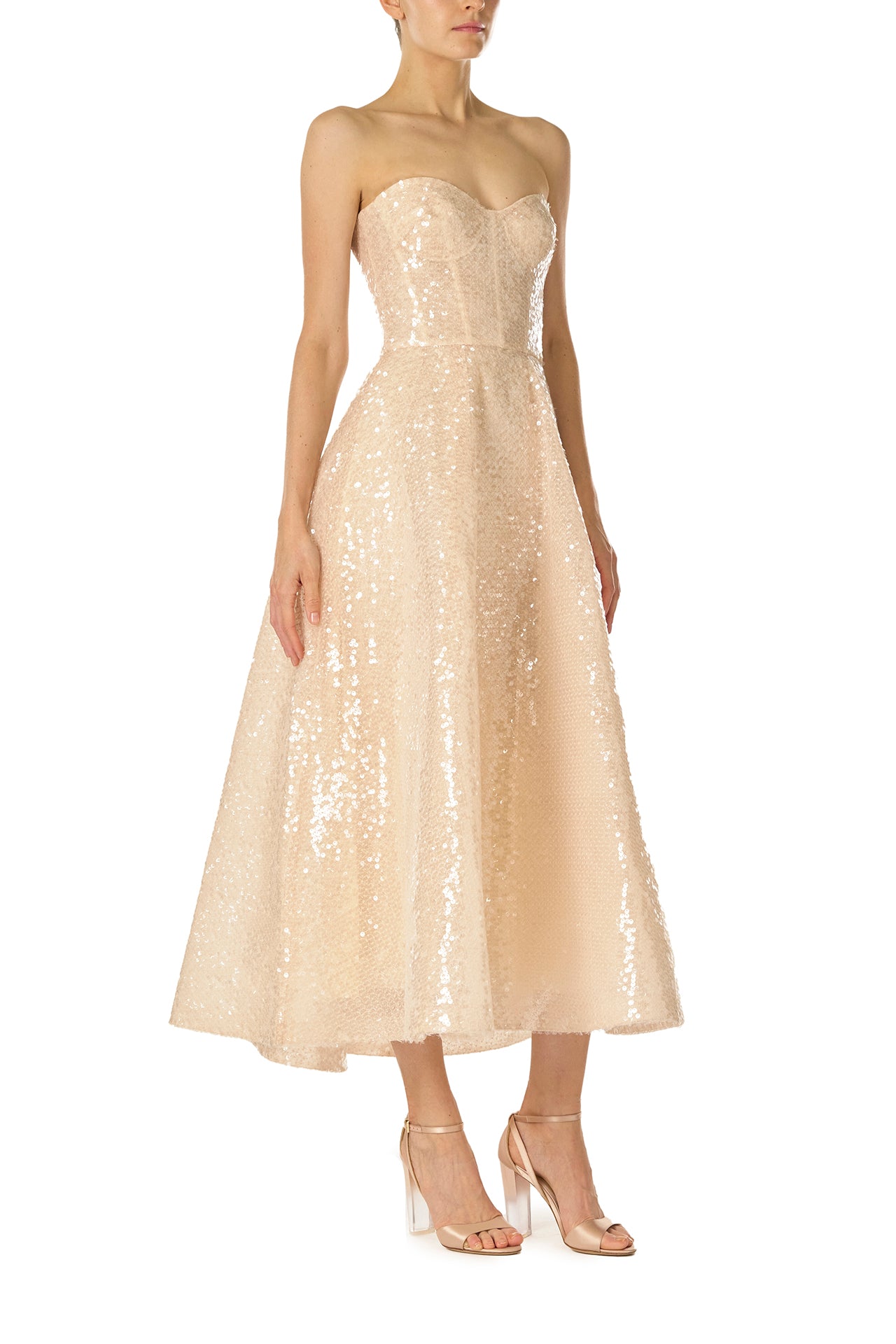 Monique Lhuillier Spring 2025 strapless, tea-length dress with sweetheart neckline in prosecco colored sequins - side.
