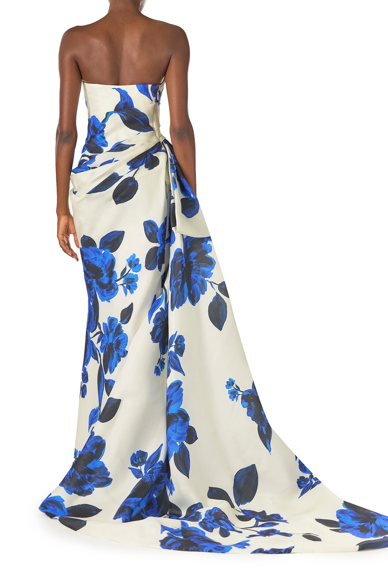 Monique Lhuillier Spring 2025 Strapless, column gown with asymmetric neckline, tufted draping and sweeping side train in Nautical Blue Floral printed gazar - back.