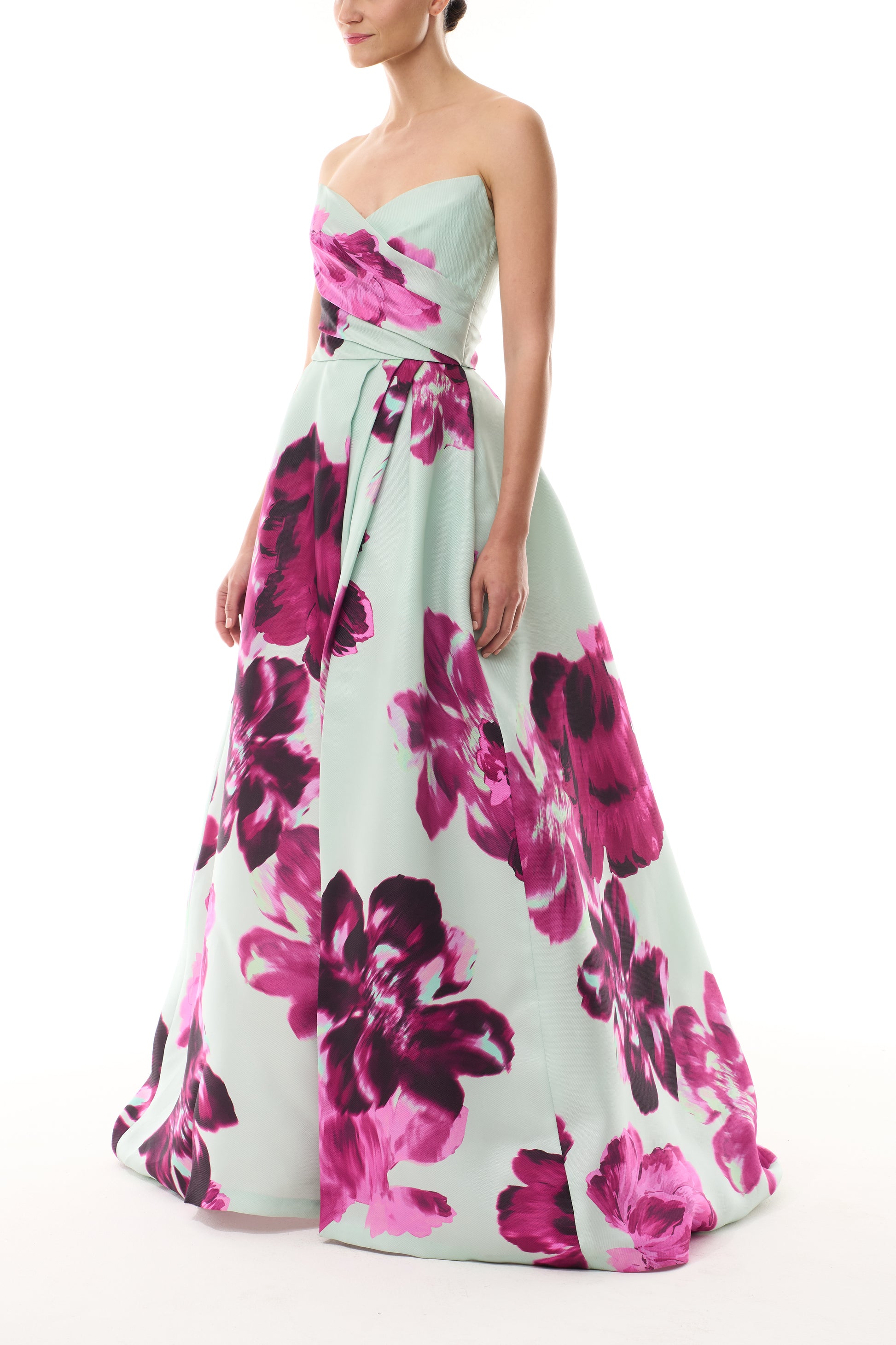 Monique Lhuillier Fall 2025 strapless ballgown with high leg slit and pockets in electric floral printed gazar - side.
