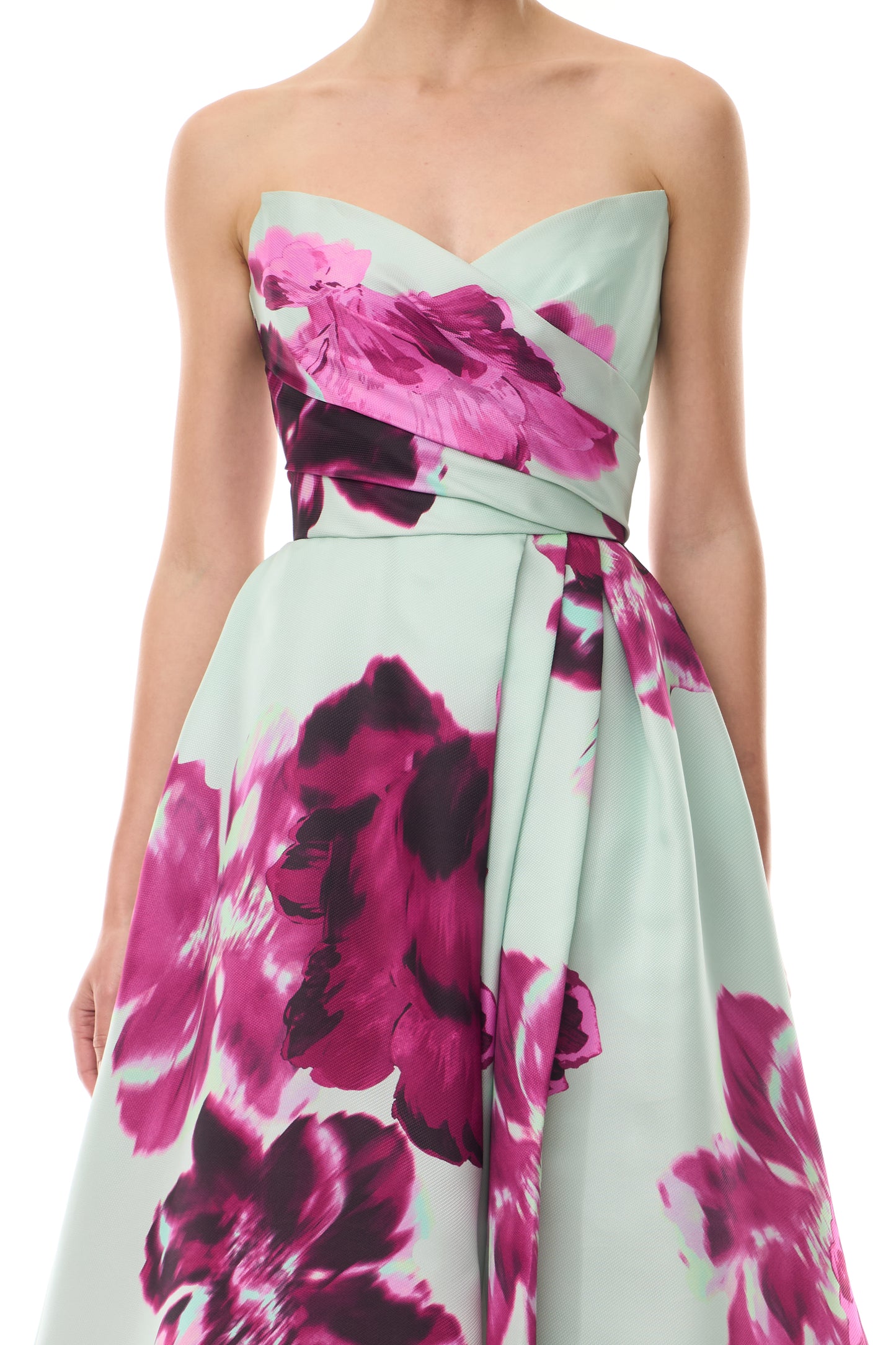 Monique Lhuillier Fall 2025 strapless ballgown with high leg slit and pockets in electric floral printed gazar - fabric.