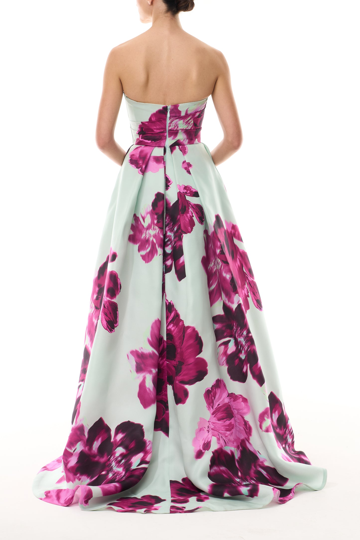 Monique Lhuillier Fall 2025 strapless ballgown with high leg slit and pockets in electric floral printed gazar - back.
