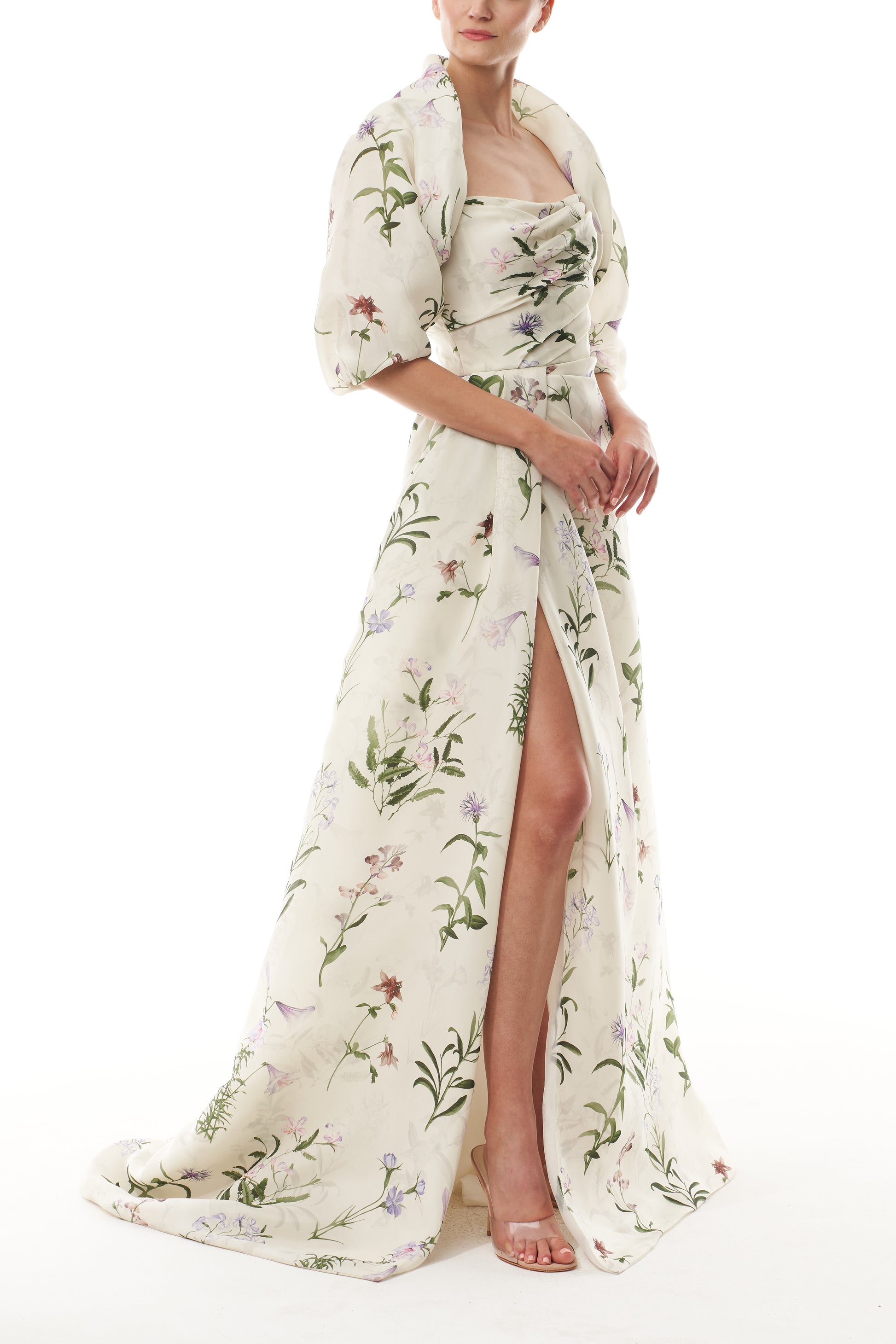 Monique Lhuillier Fall 2025 high neck bolero in floral gazar shown over the matching strapless gown - side.