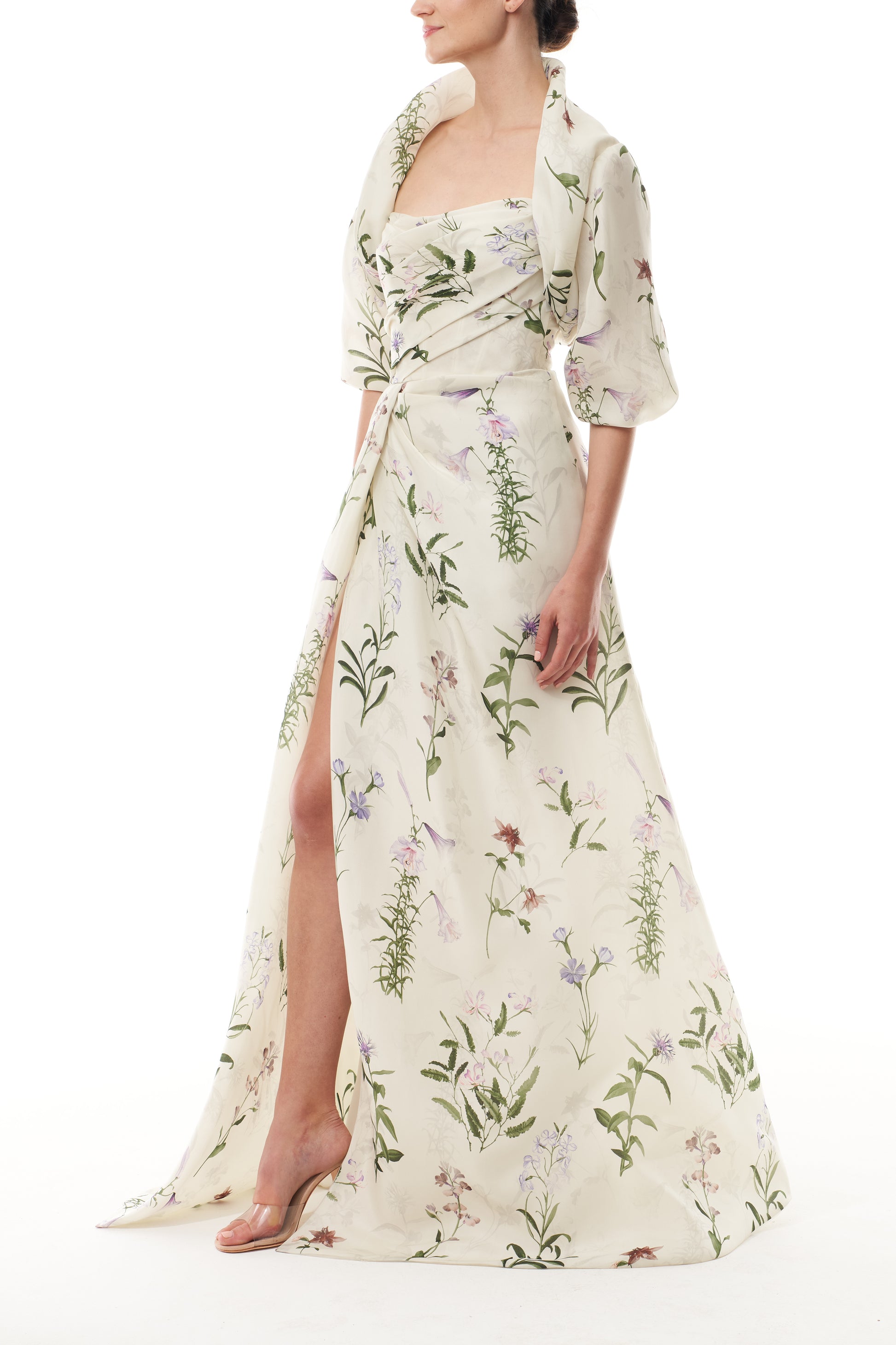 Monique Lhuillier Fall 2025 high neck bolero in floral gazar shown over the matching strapless gown - side.
