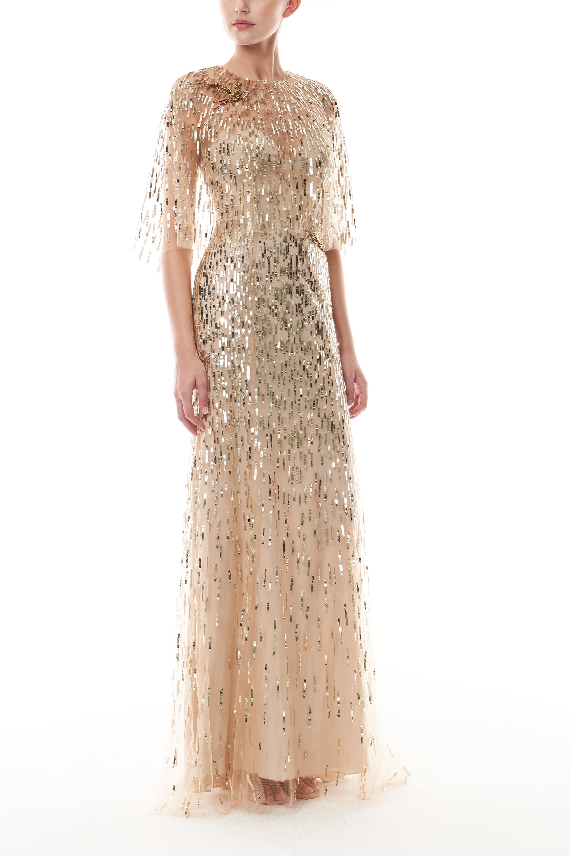 Monique Lhuillier Fall 2025 gold sequin embroidered tulle gown with integral capelet - side.