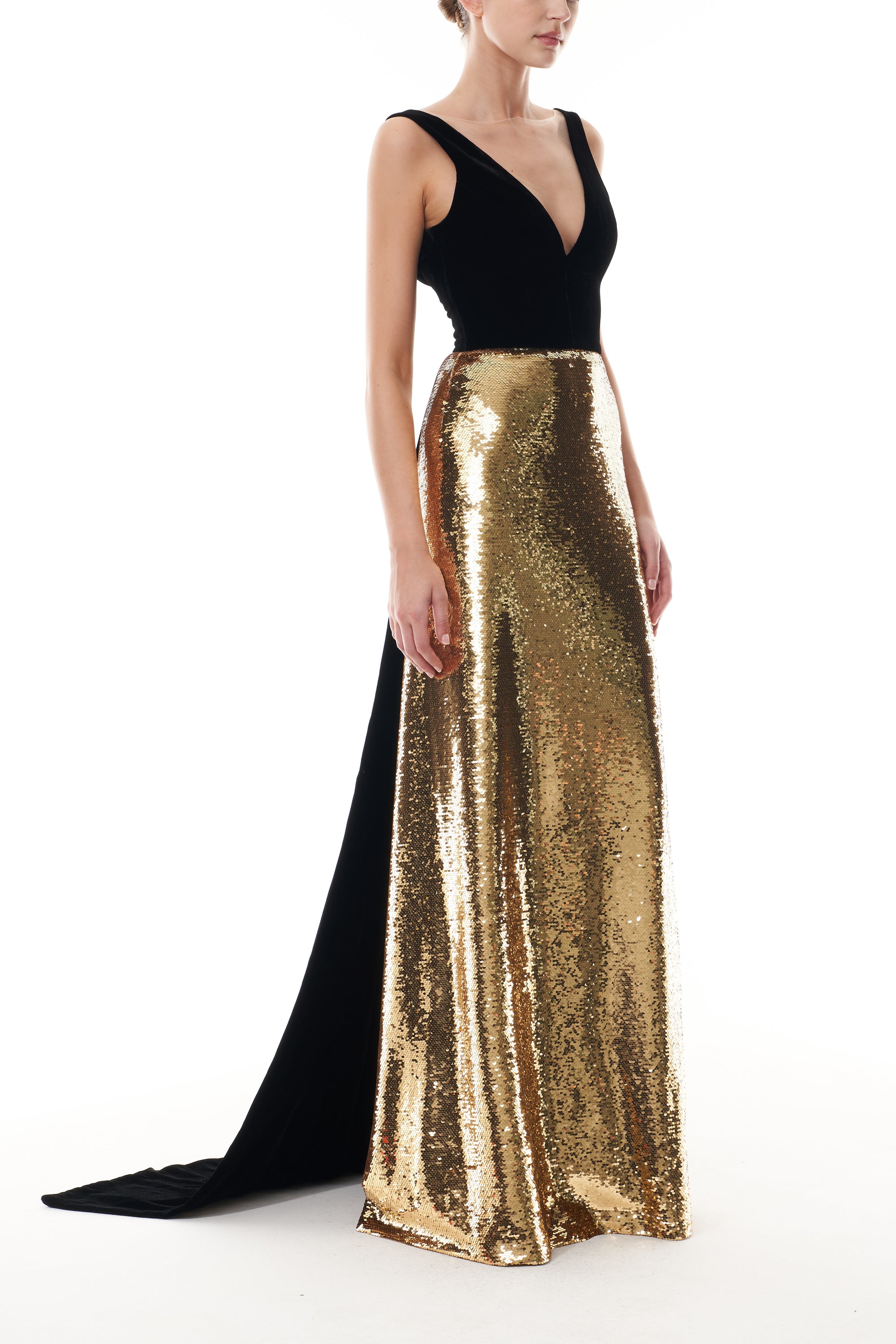 Monique Lhuillier Fall 2025 deep v-neck gown with train in noir velvet and gold sequins - side.