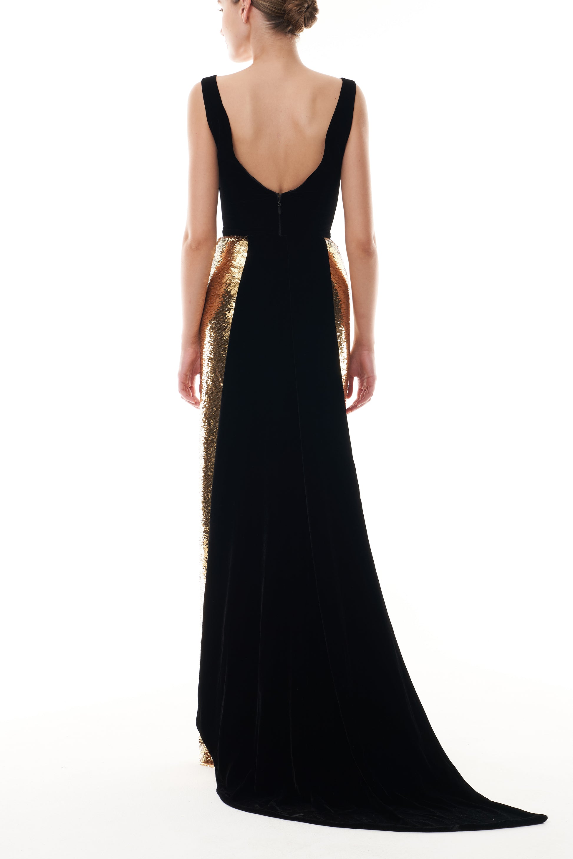 Monique Lhuillier Fall 2025 deep v-neck gown with train in noir velvet and gold sequins - back.
