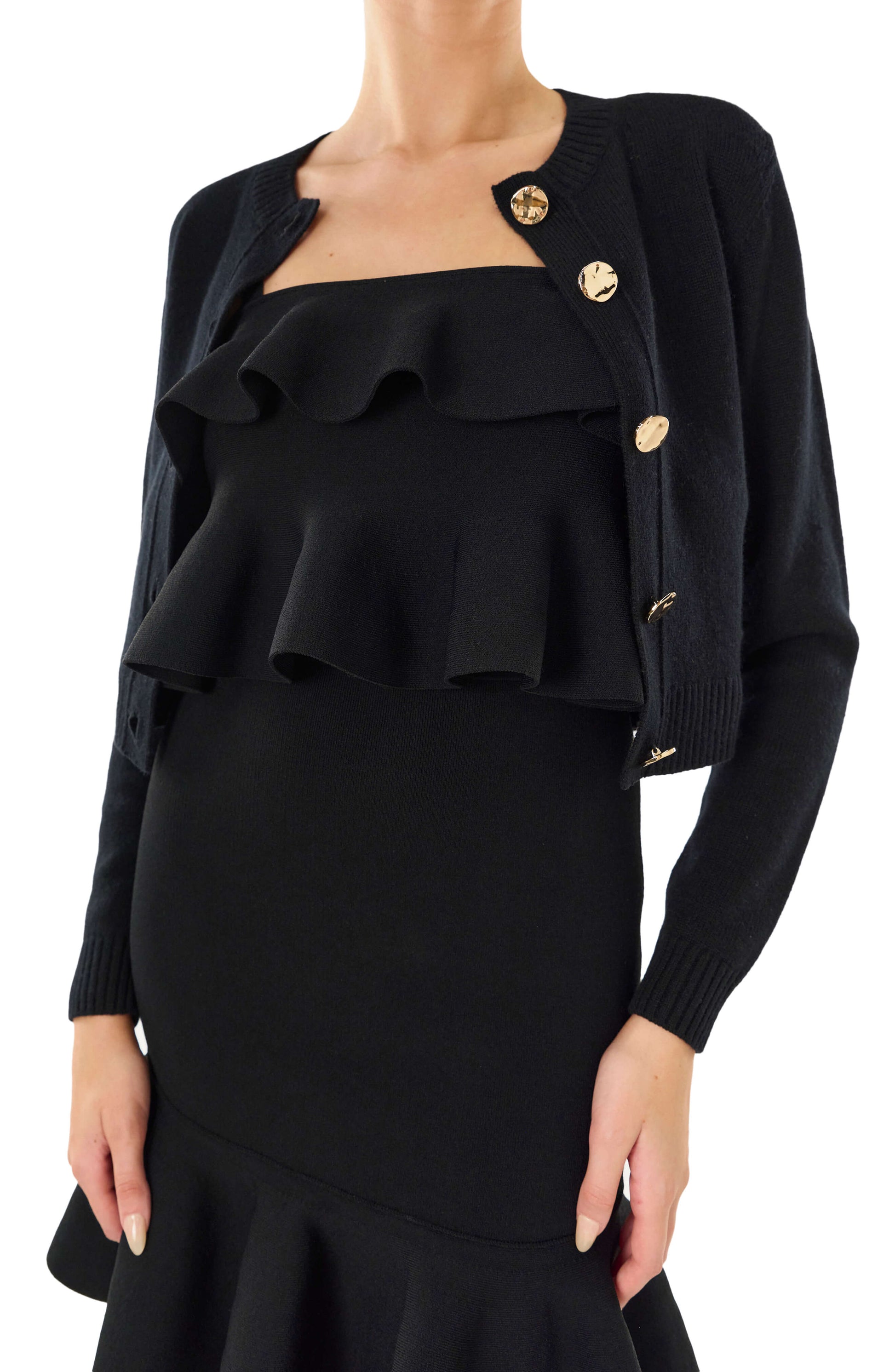 Monique Lhuillier black long sleeve cropped cardigan with gold buttons.