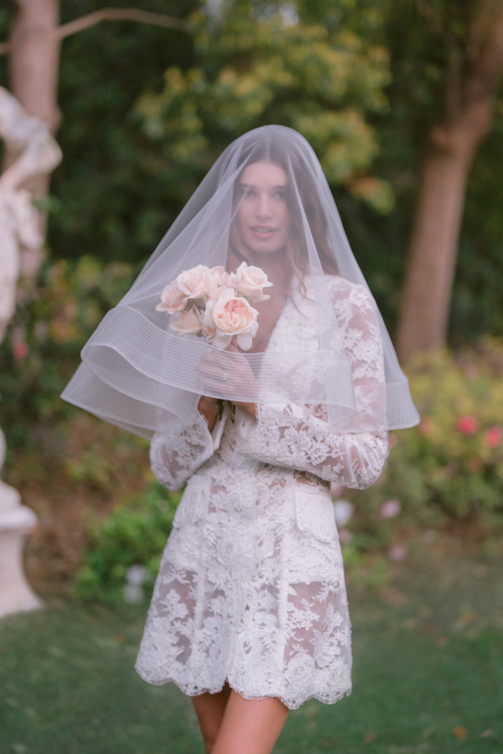 Long sleeve silk white lace Claude dress on model.