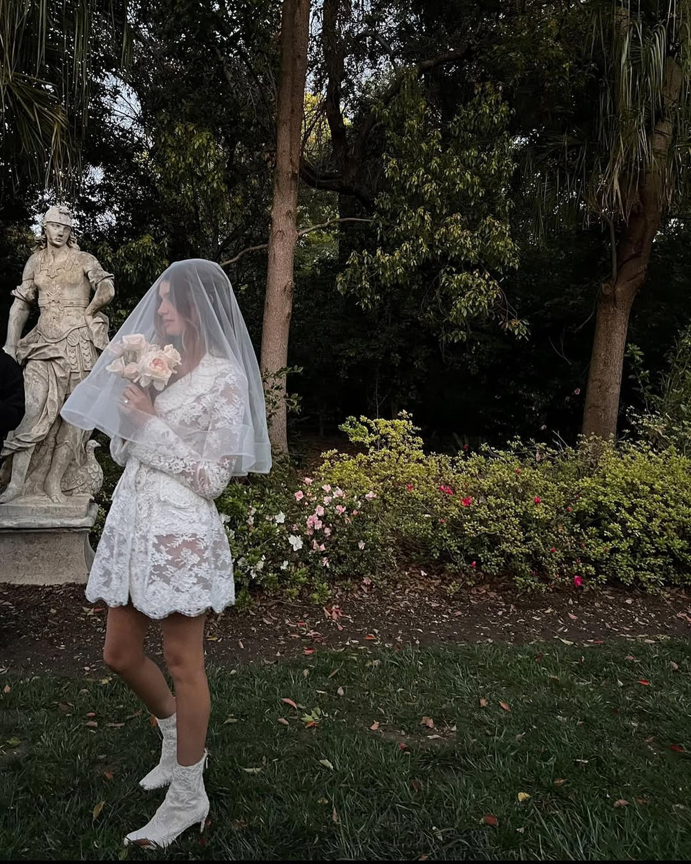 Long sleeve silk white lace Claude dress on model - side.