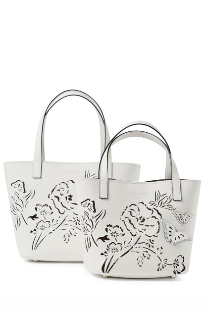 Leather top handle tote bag with laser cut florals, three-dimensional leather butterflies and small zip pouch in Ivory- front, large and small tote