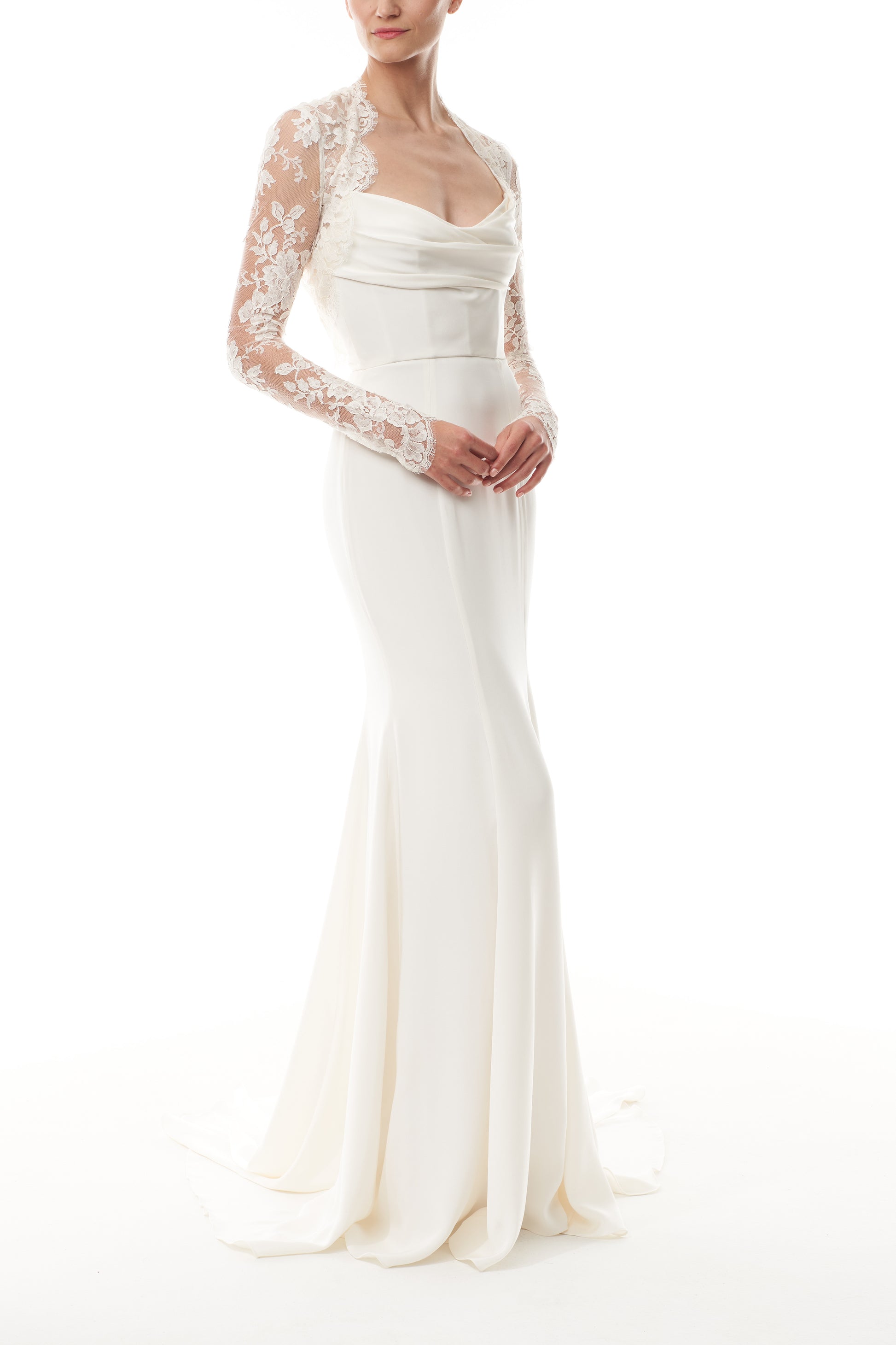 Silk white, long sleeve lace bolero shown over a strapless satin gown - angled. 