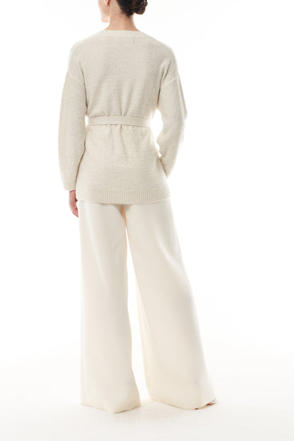 Monique Lhuillier Fall 2025 long sleeve cardigan in ivory sequin cashmere with bow brooch and self-tie belt - back.