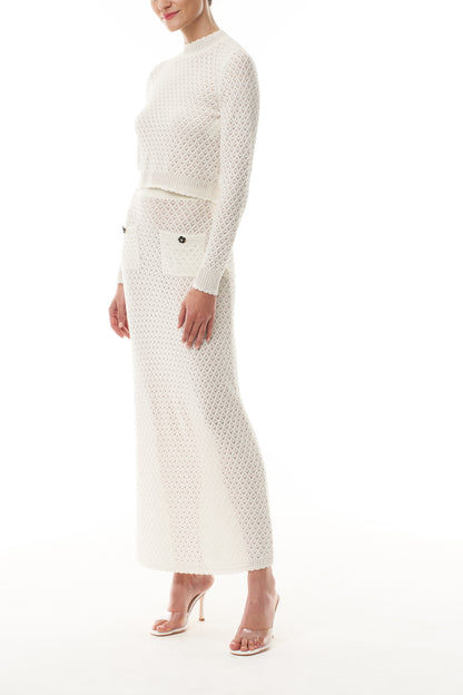 Monique Lhuillier Fall 2025 cotton diamond lace knit long sleeve top and midi skirt- side.