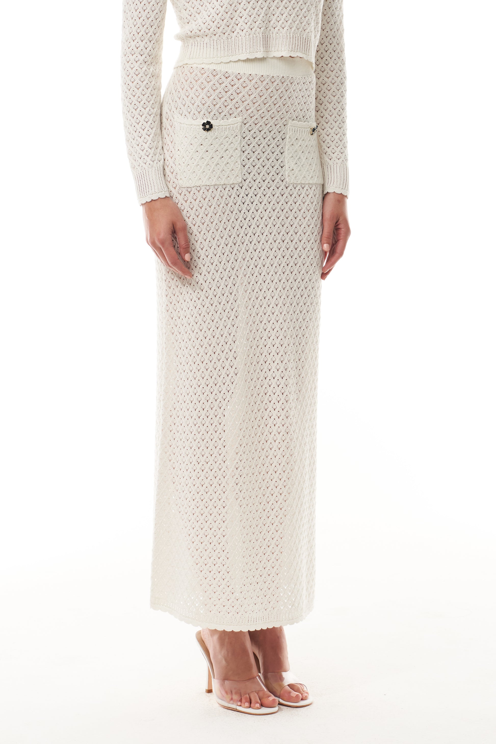 Monique Lhuillier Fall 2025 cotton diamond lace knit long sleeve top and midi skirt- fabric.