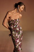 Monique Lhuillier Spring 2026 lookbook image - model wearing carnation/multi tulip sequin embroidered strapless column gown
