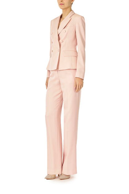 Monique Lhuillier Fall 2024 pale blush wool, double breasted wool blazer with full length sleeve - left side.