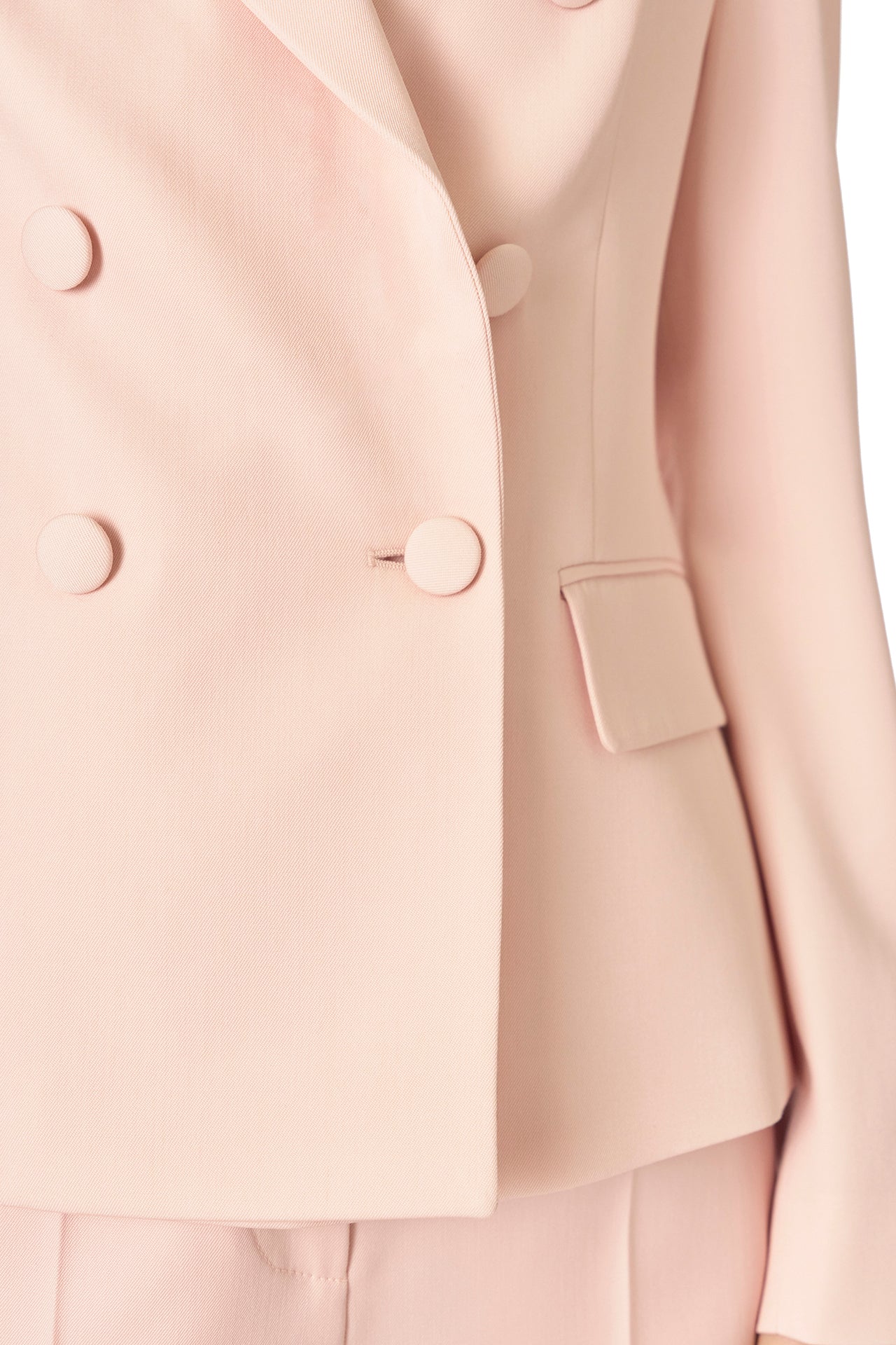 Monique Lhuillier Fall 2024 pale blush wool, double breasted wool blazer with full length sleeve - detail.