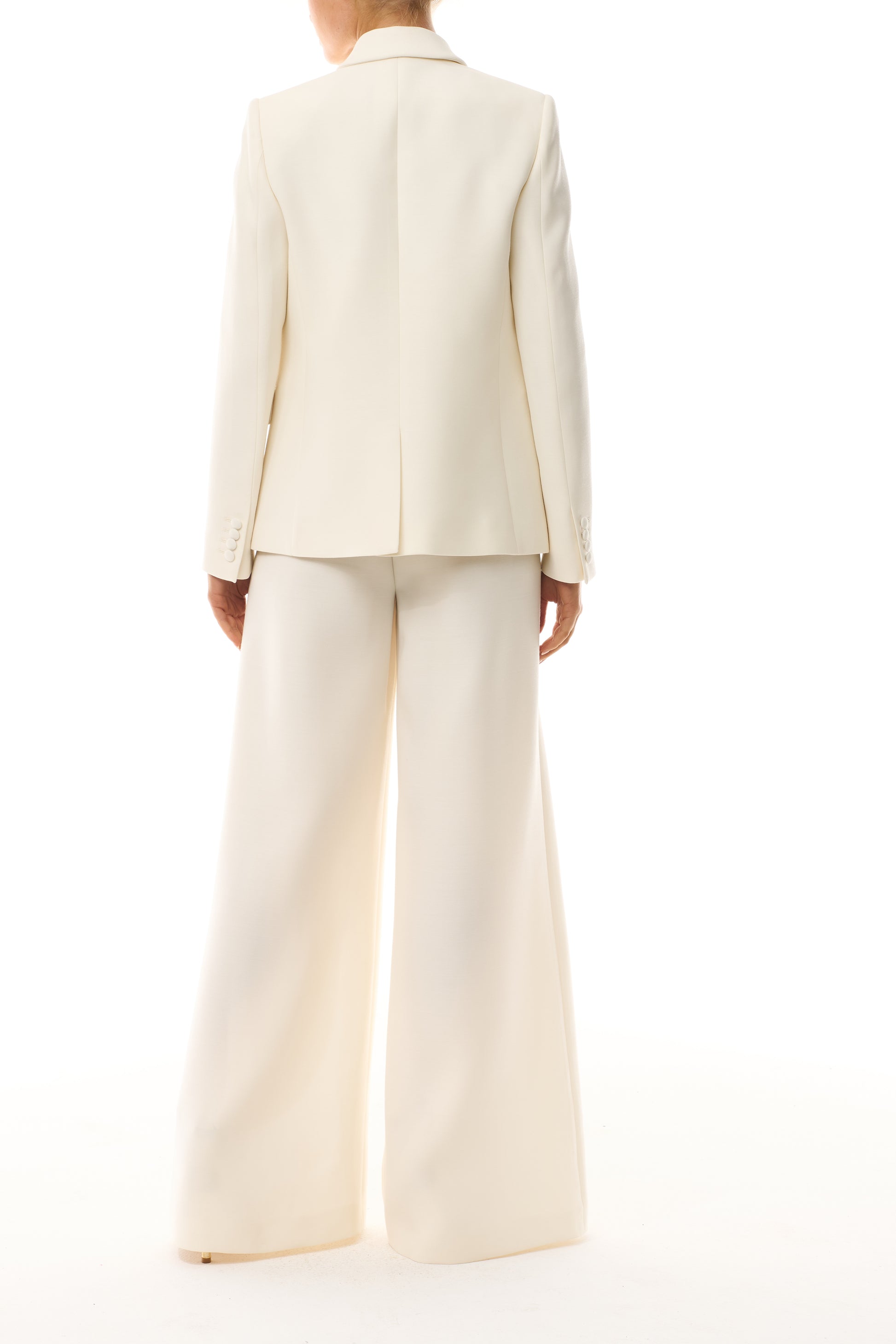 Monique Lhuillier Spring 2025 Long sleeve, double-breasted tuxedo jacket in Silk White wool/silk suiting - back.