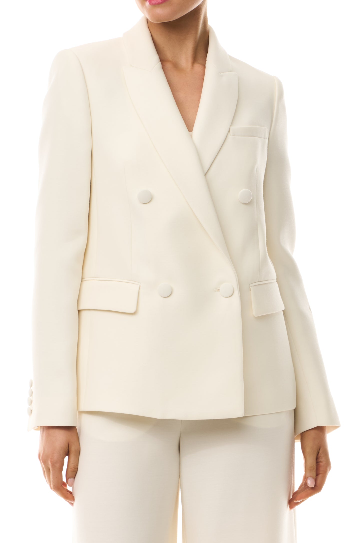 Monique Lhuillier Spring 2025 Long sleeve, double-breasted tuxedo jacket in Silk White wool/silk suiting - front buttoned.