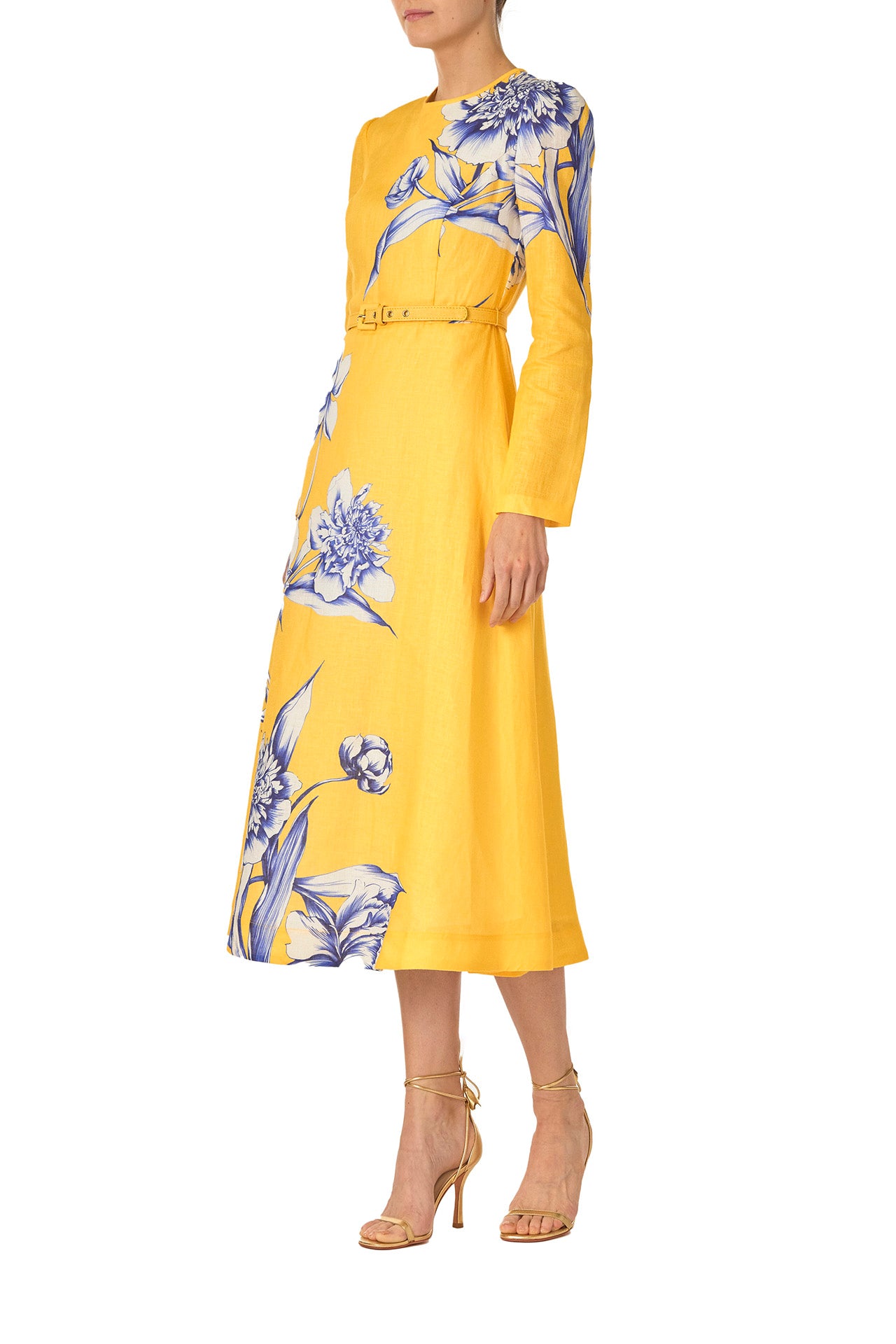 Monique Lhuillier Spring 2025 Floral printed linen long sleeve day dress with jewel neckline and circular skirt in yellow sunflower print - left side.