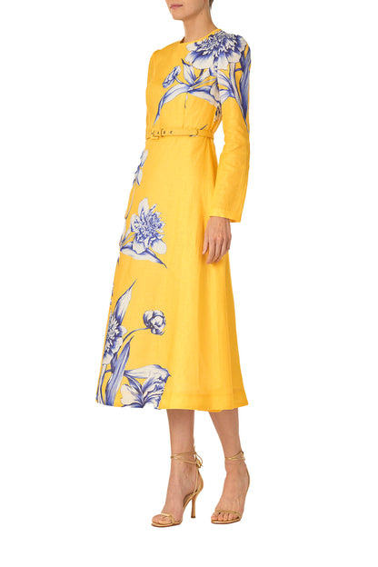 Monique Lhuillier Spring 2025 Floral printed linen long sleeve day dress with jewel neckline and circular skirt in yellow sunflower print - left side.