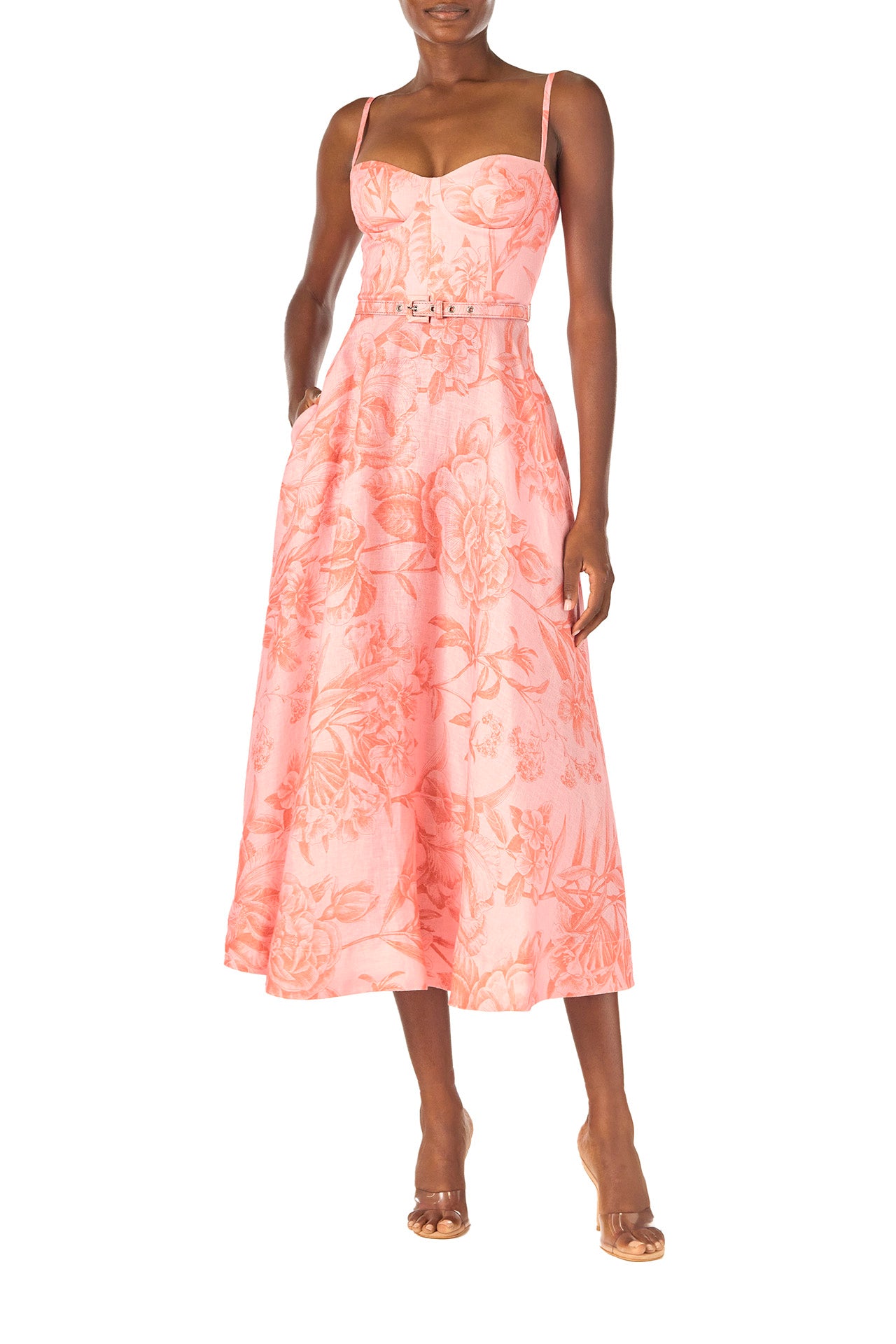 Monique Lhuillier Spring 2025 Floral printed a-line midi dress with spaghetti straps, corseted bodice and pockets in Rosette Coral colored linen - pockets.