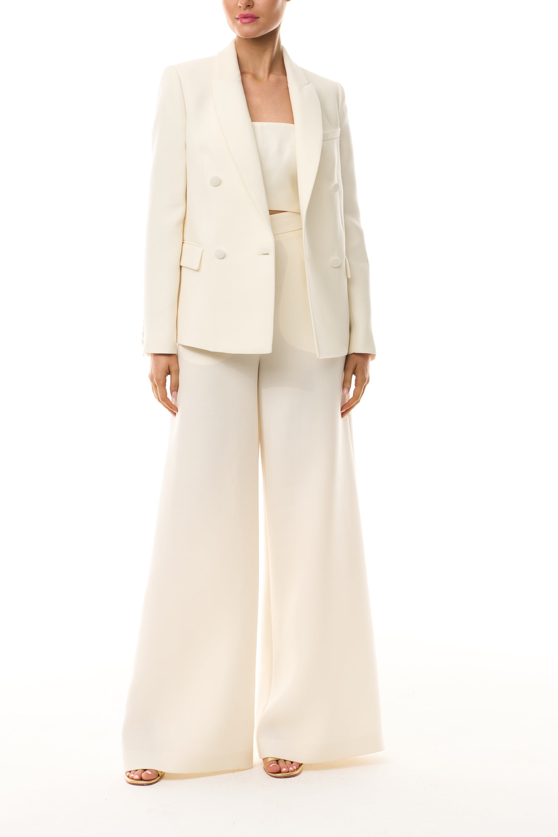 Monique Lhuillier Spring 2025 strapless bandeau in silk white wool suiting fabric - front with blazer.