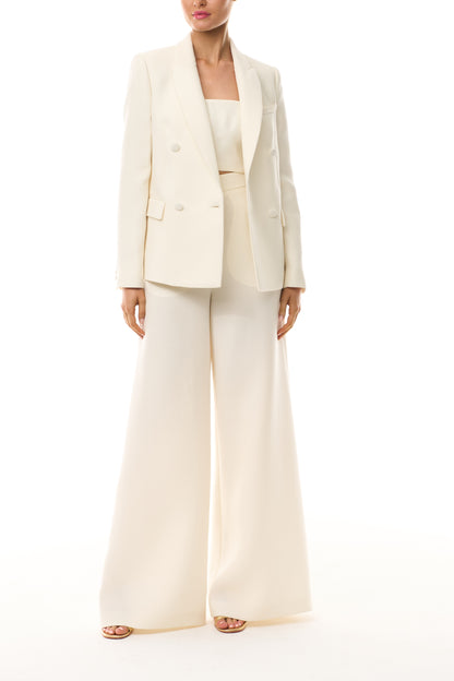 Monique Lhuillier Spring 2025 strapless bandeau in silk white wool suiting fabric - front with blazer.