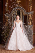 Woman wearing Monique Lhuillier Spring 2019 blush strapless plunging sweetheart chantilly lace Helena ball gown with sculpted circular skirt