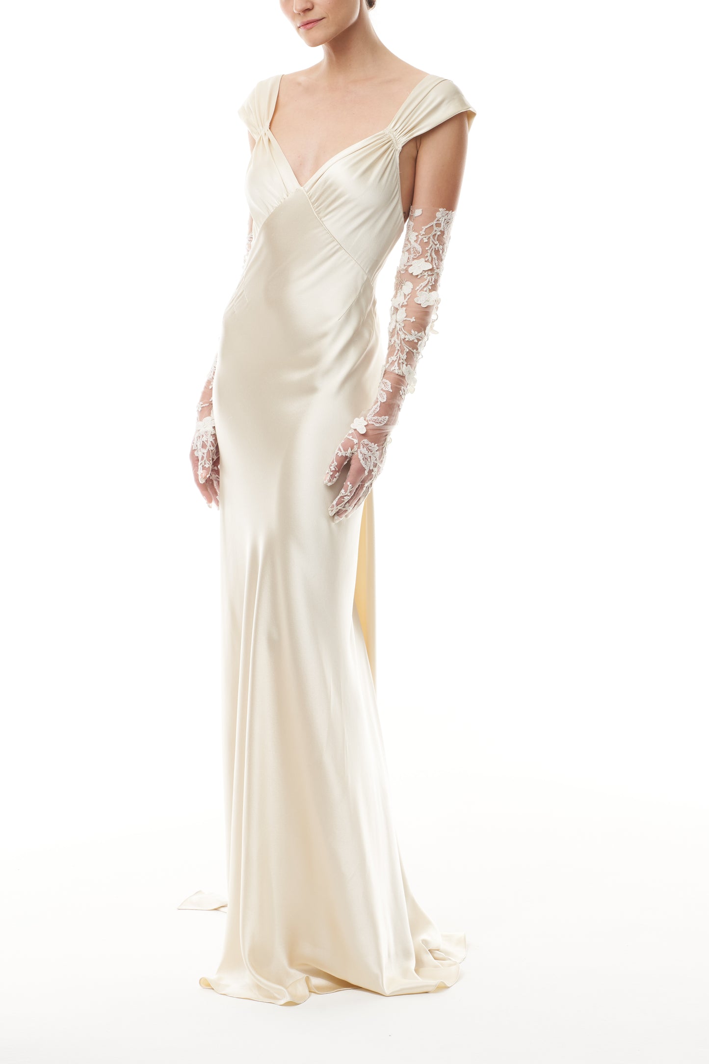 Opera length tulle gloves in metallic ivory floral embroidery.  Shown with an ivory satin gown.