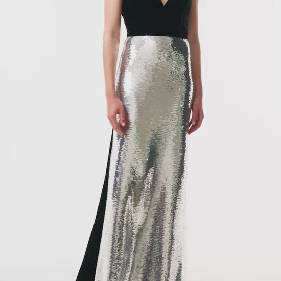 Monique Lhuillier Fall 2025 deep v-neck gown with train in noir velvet and silver sequins - video.