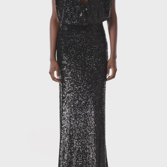 Monique Lhuillier black stretch sequin gown with deep v-neck front.