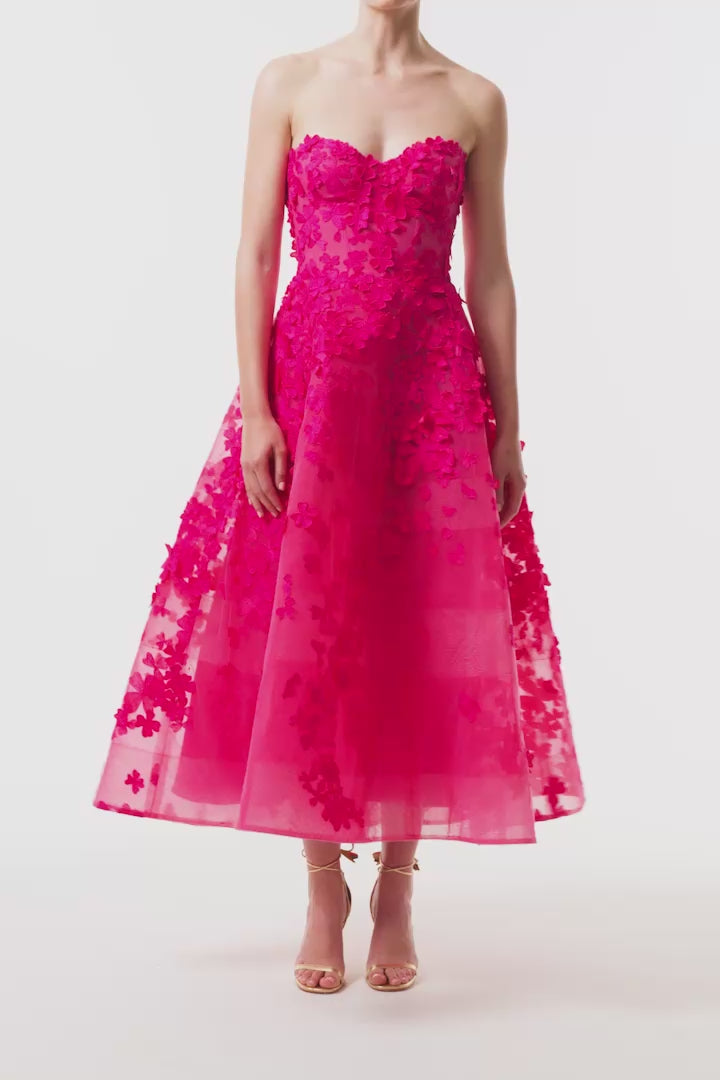 Monique Lhuillier Fall 2026 strapless, tea-length dress with sweetheart neckline in Cerise colored embroidered lace - video.