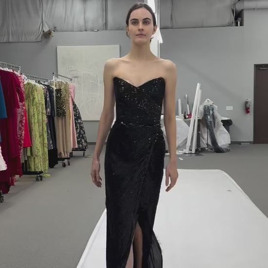 Monique Lhuillier Fall 2025 Noir embroidered tulle Strapless draped columngown with high slit - behind the scenes footage from atelier