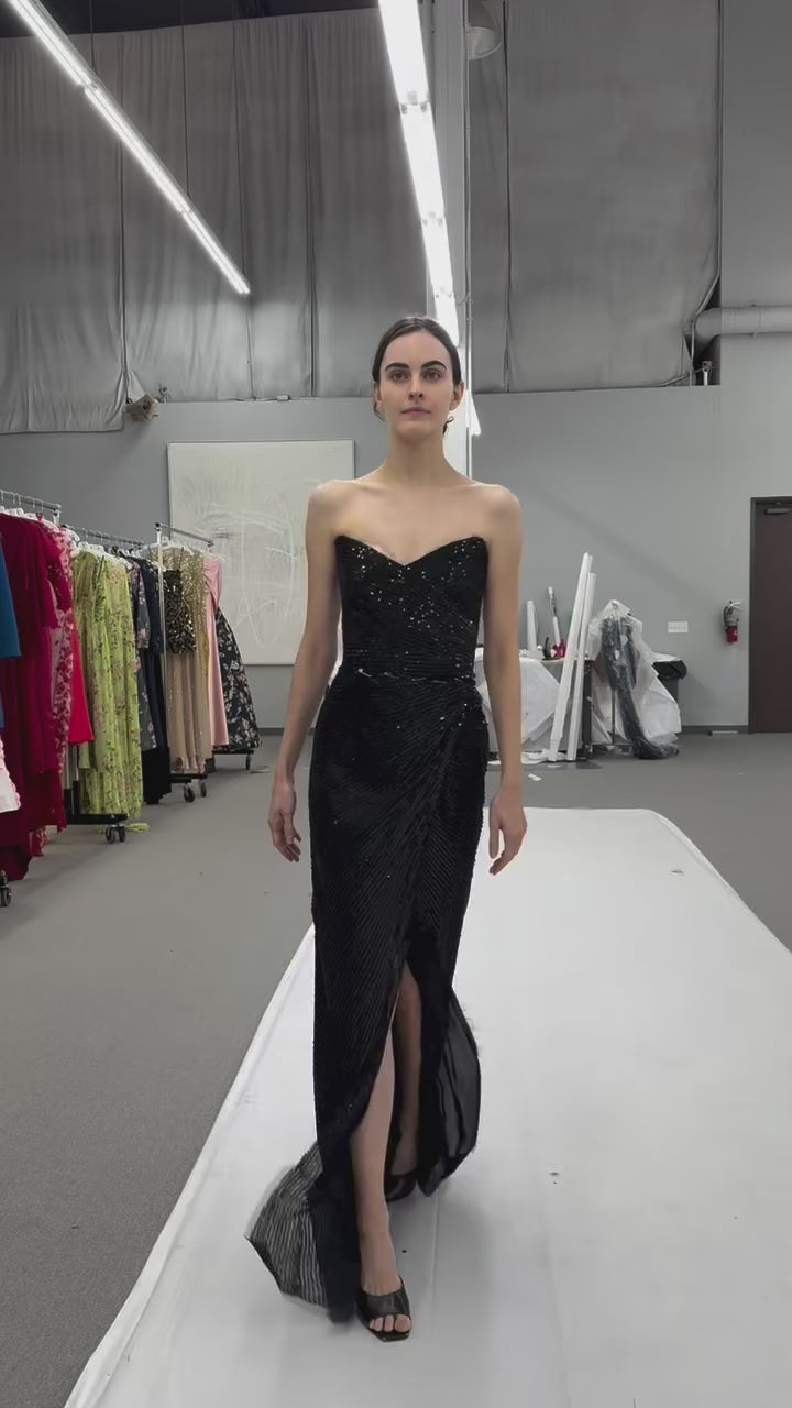 Monique Lhuillier Fall 2025 Noir embroidered tulle Strapless draped columngown with high slit - behind the scenes footage from atelier