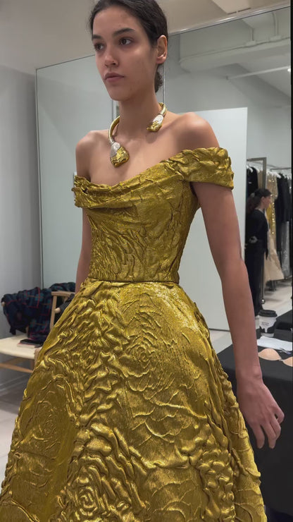 Monique Lhuillier Fall 2025 gold lame rose jaquard  Off-the-shoulder draped bodice ball gown behind the scenes footage at atelier 