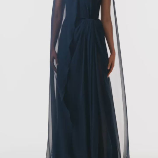 Monique Lhuillier Fall 2025 strapless draped gown with floor-length cape in Ocean chiffon - video.