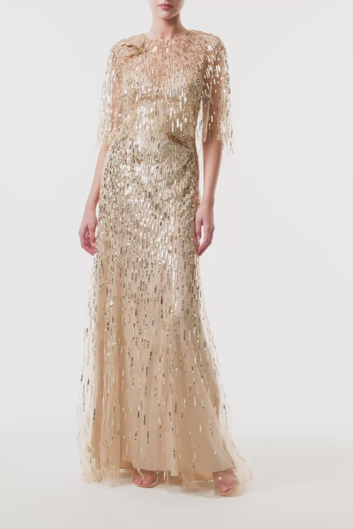 Monique Lhuillier Fall 2025 gold sequin embroidered tulle gown with integral capelet - video.